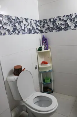 a bathroom with a white toilet in a room at Les jardins d'Ifrane in Ifrane