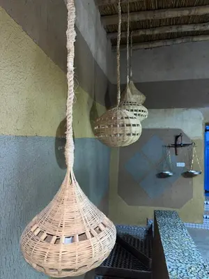 a group of baskets hanging from the ceiling at Auberge Lwalida in Ouled Sguir