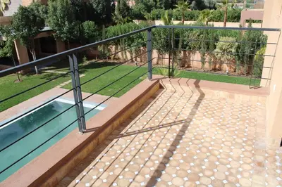 a metal railing next to a swimming pool at Villa Bakhta in Najem