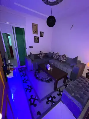a living room with purple lighting in a living room at Perfect Cozy Apartment in City Center Hamrya in Meknès