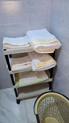 a stack of folded towels on a shelf in a bathroom at Lovelystay in Fes in Fès