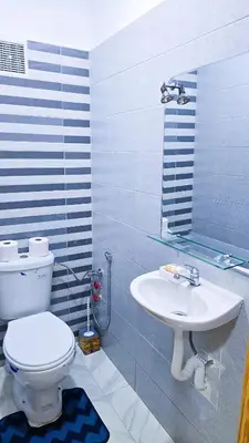 a bathroom with a toilet and a sink at Lovelystay in Fes in Fès