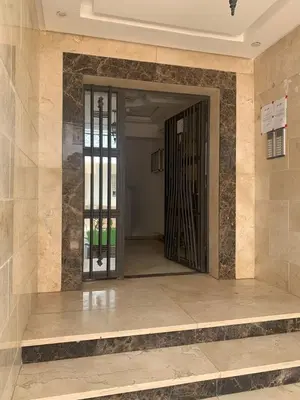 an entrance to a building with a revolving door at martil in Oulad Akkou