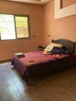 a bedroom with a large bed in a room at Ourika in Ourika
