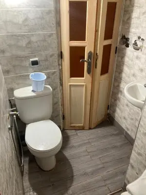 a bathroom with a toilet and a sink at Ourika in Ourika