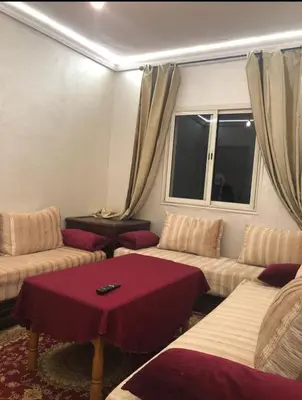 a living room with two couches and a table at Apartment with beautiful view in the center of Marrakech in Oulad Akkou