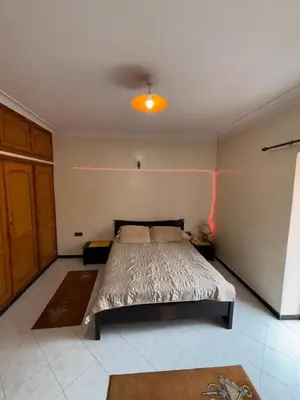a bedroom with a bed and a ceiling at Belle Chambre Dans Une Villa in Oulad Akkou