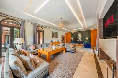 a living room with a couch and a table at Villa Hiba Luxury & Paddle in Najem