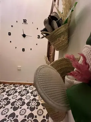 a room with a clock on the wall at Chic accommodation in Moroccan style in Oulad Akkou