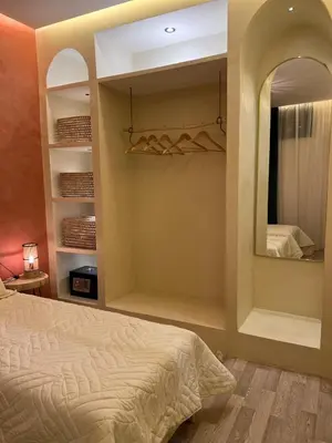 a bedroom with a bed and a mirror at Chic accommodation in Moroccan style in Oulad Akkou