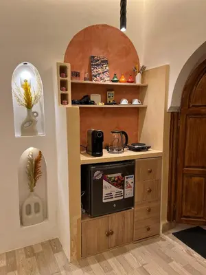 a kitchen with a counter with a stove in it at Chic accommodation in Moroccan style in Oulad Akkou