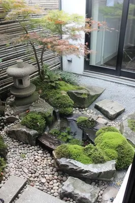 a japanese garden with a pond and a tree at Villa Close to Lhdim Square in Meknès