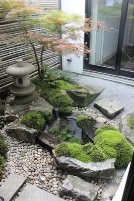 a japanese garden with a pond and a tree at Villa Close to Lhdim Square in Meknès