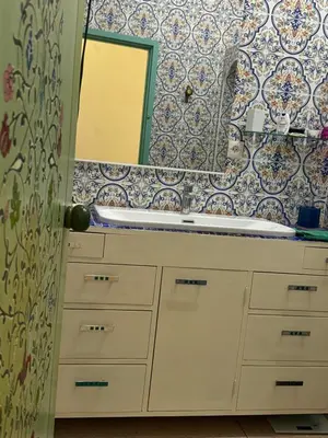 a bathroom with a sink and a mirror at Villa Zaïtoun in Aït Ourir