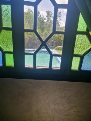 a window in a room with a view of the water at Villa Jenate Serenitée et paix in Timalizèn