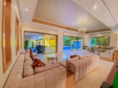 a large living room with a large couch at Villa de luxe à louer Marrakech in Ourika