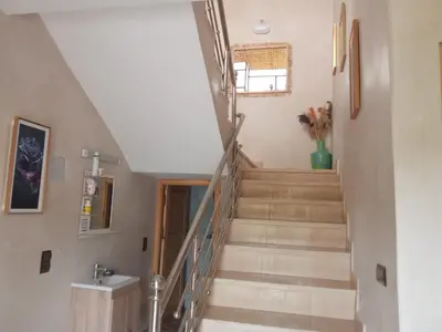 a staircase in a home with a stair case at Villa tagmouti in Aghmat