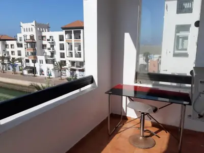a room with a desk and a window with a view at حي السلام أكادير in Oulad Akkou
