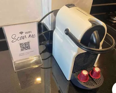a toaster with a sign that says scam me at Luxueux Appartement Prestigia avec Wifi 100 M in Fès