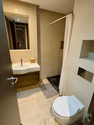 a bathroom with a toilet and a sink at Luxueux Appartement Prestigia avec Wifi 100 M in Fès