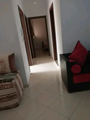 a living room with a couch and a mirror at العنوان حي المقاومة بلوك دال رقم 389 مكرر ورزازات in Oulad Akkou