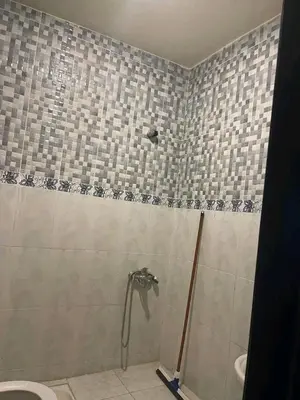 a shower in a bathroom with a toilet at العنوان حي المقاومة بلوك دال رقم 389 مكرر ورزازات in Oulad Akkou