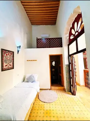 a bedroom with two beds in a room at Riad Ayoub Fes in Fès