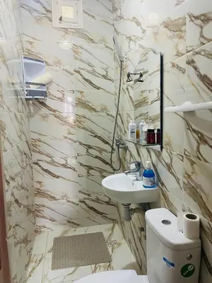 a bathroom with a sink and a toilet at Villa MSHolidays 3 palmiers avec piscine marrakech in Marrakech