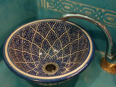 a blue and white sink with a faucet at Riad Sabah in Fès