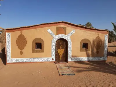 a small church with a door in the desert at Camp sahara in Oulad Akkou