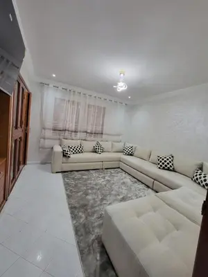 a living room with a couch and a table at Studio bahaji in Oulad Akkou