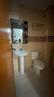 a bathroom with a sink and a toilet at البستان in Oulad Akkou