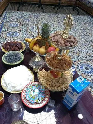 a table topped with lots of different types of food at Mom's food in Oulad Akkou