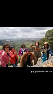 a group of people standing on top of a mountain at Mom's food in Oulad Akkou