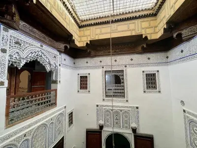 a room with white walls and a ceiling at Dar Drouj a Special 14th Century Familyhouse Riad in Fès
