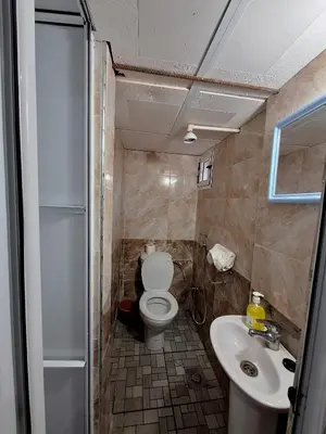 a bathroom with a toilet and a sink at Riad IZRAREN in FIGUIG in Zenaga