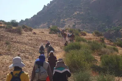 a group of people walking up a hill at Maison D'hôtes Ait Mouli in Bzou