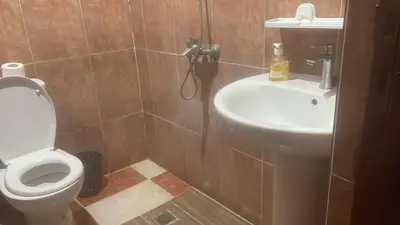 a bathroom with a toilet and a sink at Kawtar in Meknès
