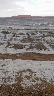 an open field with snow on the ground at Desert Hassi labiad Camp in Merzouga