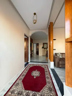 a living room with a red rug on the floor at Marrakech Private Villa with Pool, Near Ourika and Atlas Mountain in Aghmat