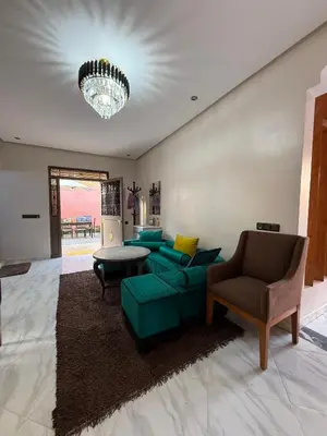 a living room with a couch and a table at Marrakech Private Villa with Pool, Near Ourika and Atlas Mountain in Aghmat