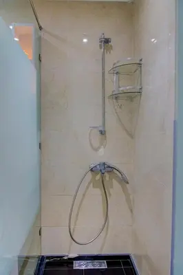 a shower with a shower head in a bathroom at Elegance in Oulad Akkou