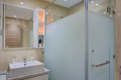 a bathroom with a sink and a shower at Elegance in Oulad Akkou