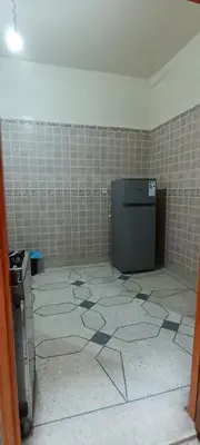 a bathroom with a tiled floor and ailed floor at belle vue in Meknès