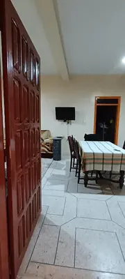 a living room with a bed and a table at belle vue in Meknès