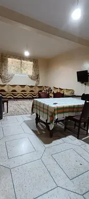 a living room with a bed and a couch at belle vue in Meknès