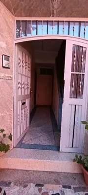 an entrance to a building with a white door at belle vue in Meknès