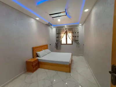 a small bedroom with a bed in a room at Dakhla in Oulad Akkou