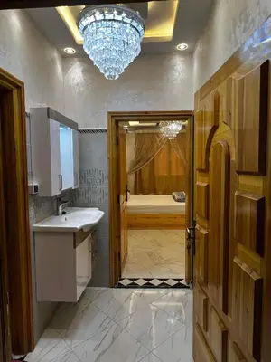 a bathroom with a sink and a bath tub at Dakhla in Oulad Akkou