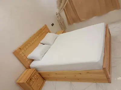 an overhead view of a bed in a room at Dakhla in Oulad Akkou